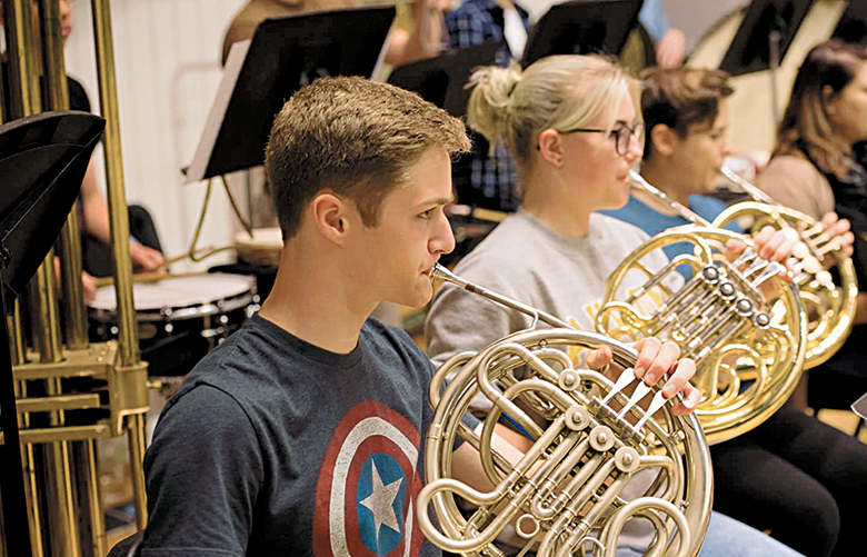 Interlake High School senior and college applicant Ethan Soloman plays French horn in the Seattle Youth Symphony orchestra. Evidence a student has a “rich and fulfilling” life outside of the classroom is one thing Adam Miller, director of admissions at Whitman College, says colleges want to see in applicants. (Courtesy of Christopher Reicks)