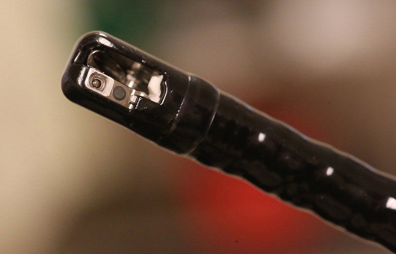 The front tip of an Olympus duodenoscope where the tube opens to a lens and articulated scoop, locations where bacteria gather and are difficult to clean.
