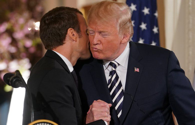 President Emmanuel Macron of France kisses President Donald Trump during a joint news conference at the White House in Washington, April 24, 2018. Trump on Tuesday decried the nuclear agreement with Iran as a â€œterrible deal,â€ but said he would use formal meetings with Macron to discuss whether to preserve it. (Doug Mills/The New York Times)  XNYT99 XNYT99