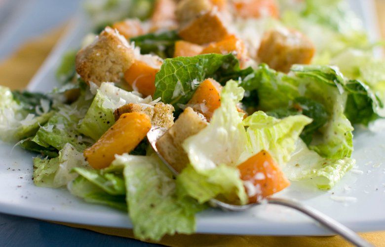 FILE – This Jan. 24, 2012, file photo shows a plate of butternut Caesar salad with Romaine lettuce and roasted cubes of butternut squash. U.S. health officials say the E. coli outbreak linked to tainted romaine lettuce has grown and sickened 84 people from 19 states. The U.S. Centers for Disease Control said Wednesday, April 25, 2018, that at least another 31 cases are believed to be tied to romaine lettuce grown in Yuma, Arizona. (AP Photo/Matthew Mead, File) FX107 FX107