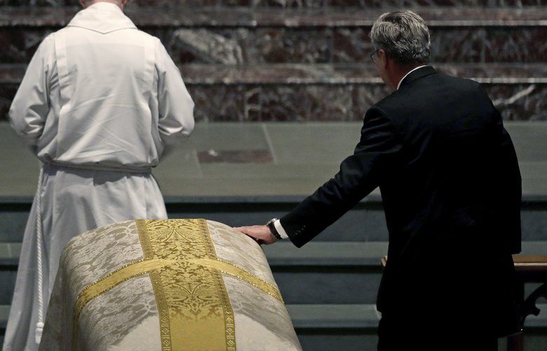 Former Florida Gov. Jeb Bush places his hand on the coffin of his mother, former first lady Barbara Bush, during her funeral service at St. Martin’s Episcopal Church in Houston, April 21, 2018. Four of the United Statesâ€™ five living former presidents were expected to gather at the church to remember the life, legacy and trademark pearls of Bush, who died on Tuesday at the age of 92. (David J. Phillip/Pool via The New York Times) — FOR EDITORIAL USE ONLY — XNYT54 XNYT54