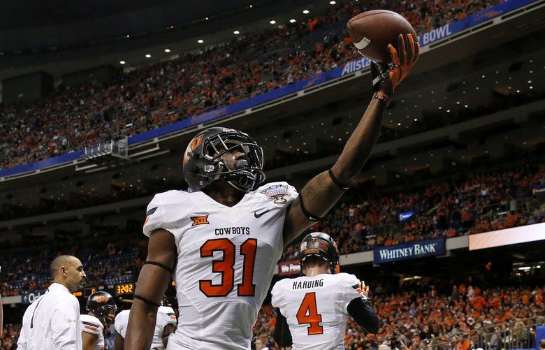 Oklahoma State safety Tre Flowers (31) warms up before the Sugar Bowl college football game against Mississippi in New Orleans, Friday, Jan. 1, 2016. (AP Photo/Jonathan Bachman) 