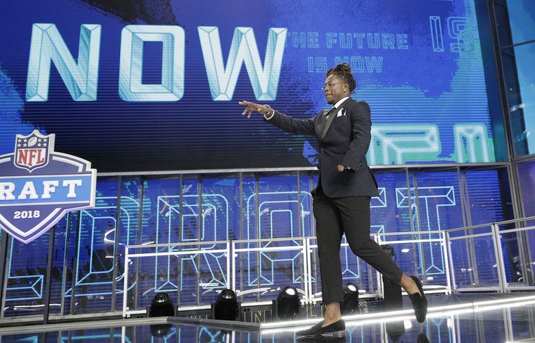 Central Florida’s Shaquem Griffin walks out onto the stage at the start of the first round of the NFL football draft, Thursday, April 26, 2018, in Arlington, Texas. (AP Photo/David J. Phillip) CBS122 CBS122