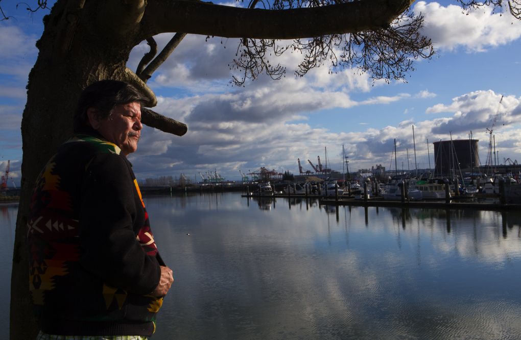 Bill Sterud, Puyallup tribal chairman, looks toward the plant from Chinook Landing Marina in Tacoma. (Ellen M. Banner/The Seattle Times)