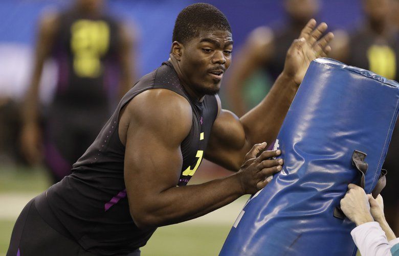 USC defensive lineman Rasheem Green runs a drill during the NFL football scouting combine, Sunday, March 4, 2018, in Indianapolis. (AP Photo/Darron Cummings) INDC1