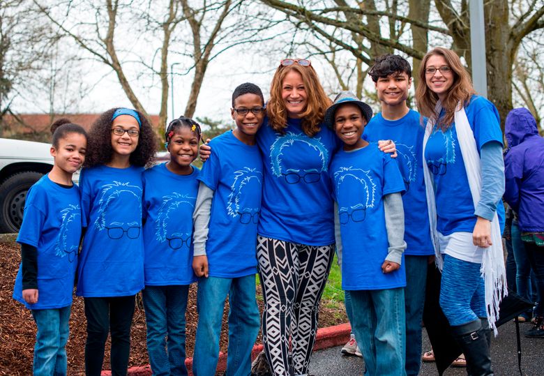 FILE – This March 20, 2016, file photo shows Hart family of Woodland, Wash., at a Bernie Sanders rally in Vancouver, Wash. A body was recovered Saturday, April 7, 2018, in the vicinity where an SUV plunged off a Northern California cliff last month, killing the family of eight in what authorities suspect may have been an intentional crash.  (Tristan Fortsch/KATU News via AP, File)