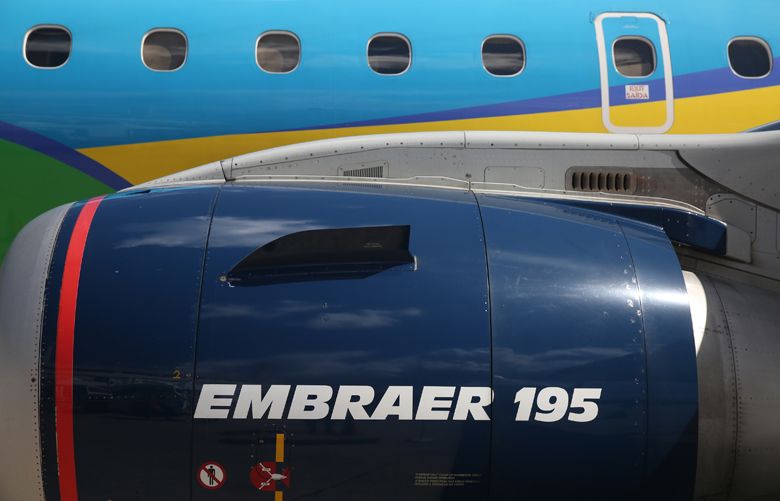 An Embraer SA 195 jet turbine aircraft operated by Azul Brazilian Airlines SA sits on the tarmac during the International Brazil Air Show (IBAS) at Rio Galeao International Airport in Rio de Janeiro, Brazil, on Saturday, April 1, 2017. Photographer: Dado Galdieri/Bloomberg