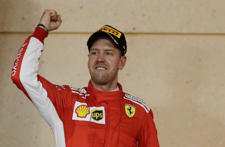 Red Bull driver Sebastian Vettel of Germany celebrates on his car