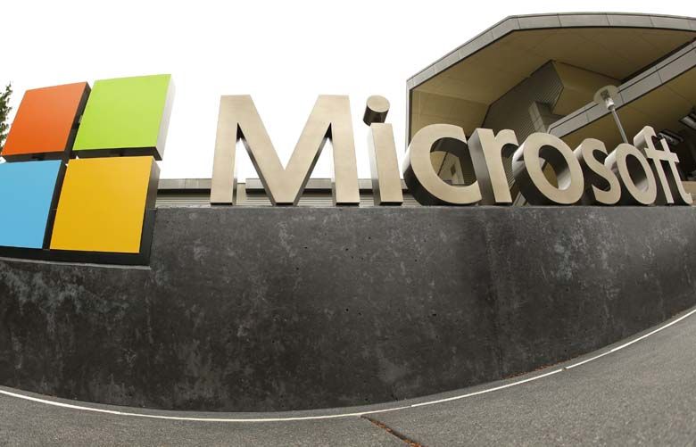 FILE – This July 3, 2014, file photo, shows the Microsoft Corp. logo outside the Microsoft Visitor Center in Redmond, Wash. Microsoft is cutting jobs announced Wednesday, May 25, 2016, as the company continues its attempts to salvage a rocky entrance into the smartphone market. (AP Photo Ted S. Warren, File) NY108
