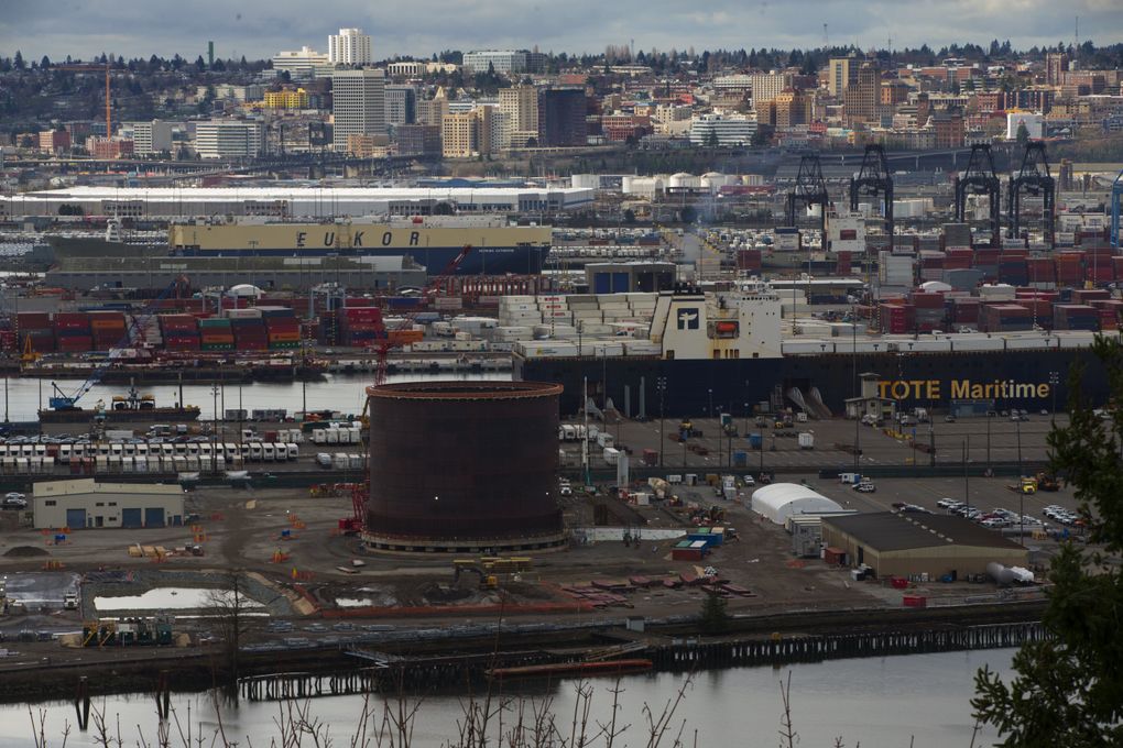 An 8 million-gallon tank that will hold liquefied natural gas is being constructed on the Tacoma tideflats. Downtown Tacoma is in the background. (Ellen M. Banner/The Seattle Times)