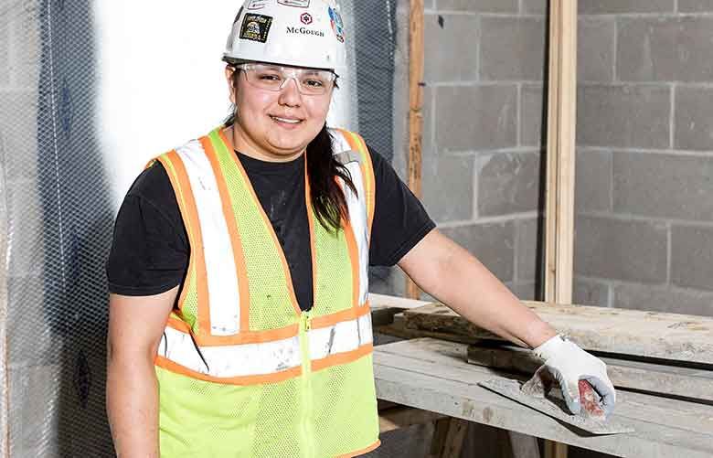 Marissa Goodsky, a concrete mason in an apprentice program, on a job in Fridley, Minnesota.  (Tim Gruber / The New York Times) 