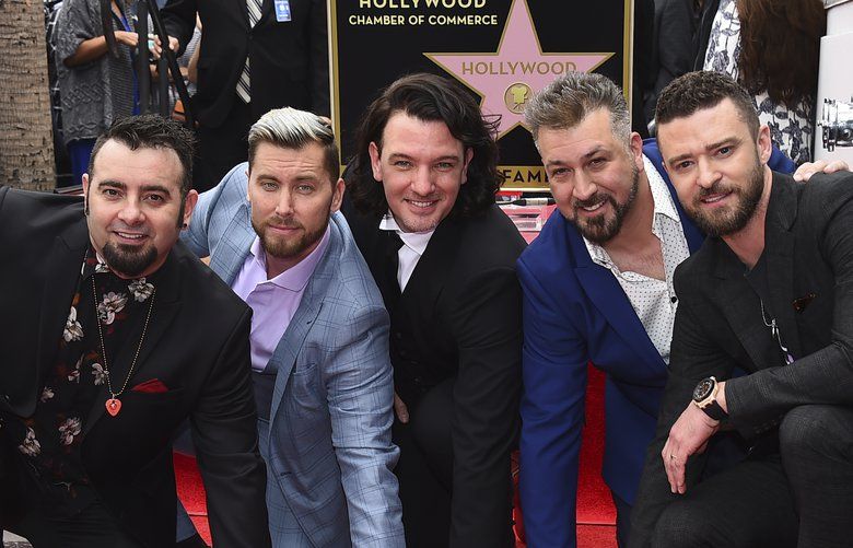 Chris Kirkpatrick, from left, Lance Bass, JC Chasez, Joey Fatone and Justin Timberlake of the band NSYNC appear at a ceremony honoring them with a star on the Hollywood Walk of Fame on Monday, April 30, 2018, in Los Angeles. (Photo by Jordan Strauss/Invision/AP) NYET202 NYET202