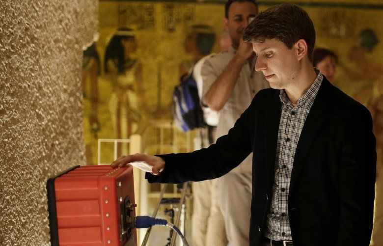 FILE – In this April 1, 2016 file photo, radar scanning experts scan a wall in King Tutankhamun’s burial chamber in the Valley of the Kings, Luxor, Egypt. Egypt’s antiquities ministry said Sunday, May 6, 2018, that new radar scans have provided conclusive evidence that there are no hidden rooms, as was earlier suspected, inside the burial chamber. (AP Photo/Amr Nabil) CAITH101 CAITH101