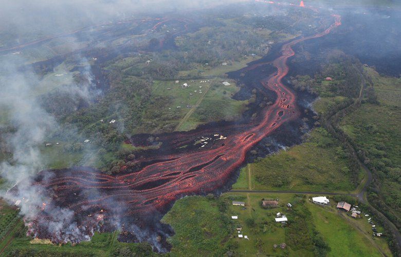 FILE- In this Saturday, May 19, 2018, file photo released by the U.S. Geological Survey, lava emerges from fissures near Pahoa, Hawaii. The eruption of Mount Kilauea in Hawaii is a reminder to business owners, even those nowhere near any of the 169 volcanoes in the U.S., that they could be vulnerable to natureâ€™s most destructive forces. And that they need to be sure theyâ€™re insured against disasters like tornadoes, earthquakes, hurricanes and flooding. (U.S. Geological Survey via AP, File) NYBZ120 NYBZ120
