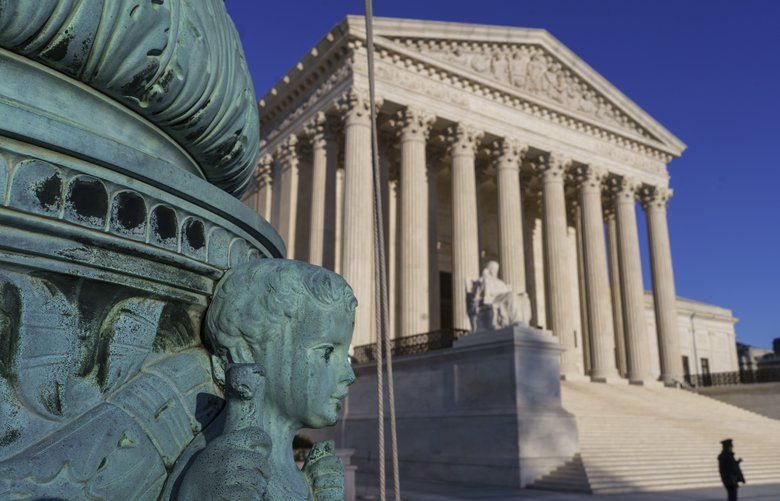 The Supreme Court is seen in Washington, April 20, 2018.  The Supreme Court says employers can prohibit their workers from banding together to complain about pay and conditions in the workplace.  (AP Photo/J. Scott Applewhite) WX102 WX102