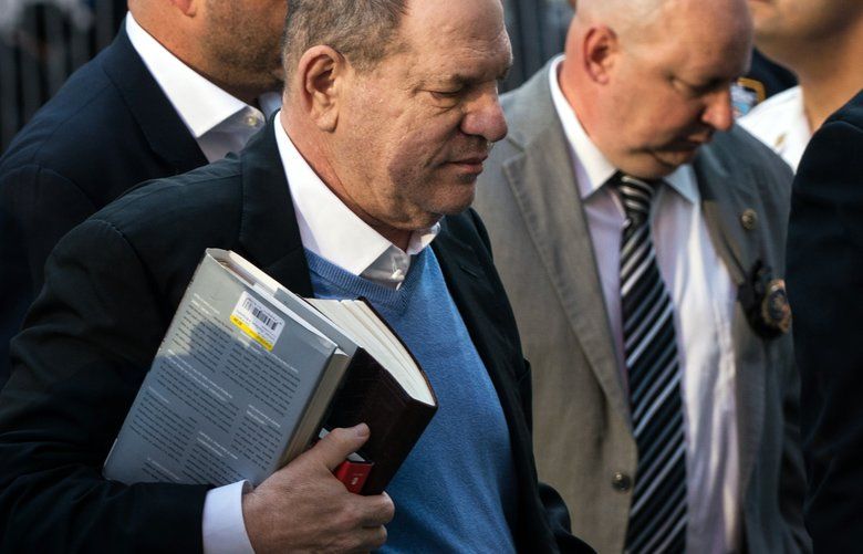 Harvey Weinstein carries books as he arrives at a police station in lower Manhattan on Friday morning, May 25, 2018. Weinstein was arrested by detectives on Friday on charges that he raped one woman and forced another to perform oral sex, capping a lengthy inquiry into the avalanche of accusations against him that spawned a public reckoning, and, with it, the global #MeToo movement. (Todd Heisler/The New York Times) XNYT1 XNYT1