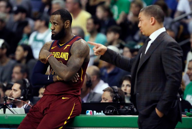 Cleveland Cavaliers' LeBron James waits during a timeout in the