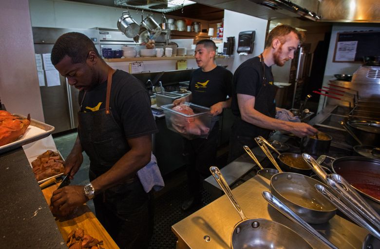 In the kitchen at JuneBaby last fall — it’s up for the James Beard award for Best New Restaurant in the U.S., while chef/owner Edouardo Jordan, left, is nominated for Best Chef Northwest. (Ellen M. Banner/The Seattle Times)
