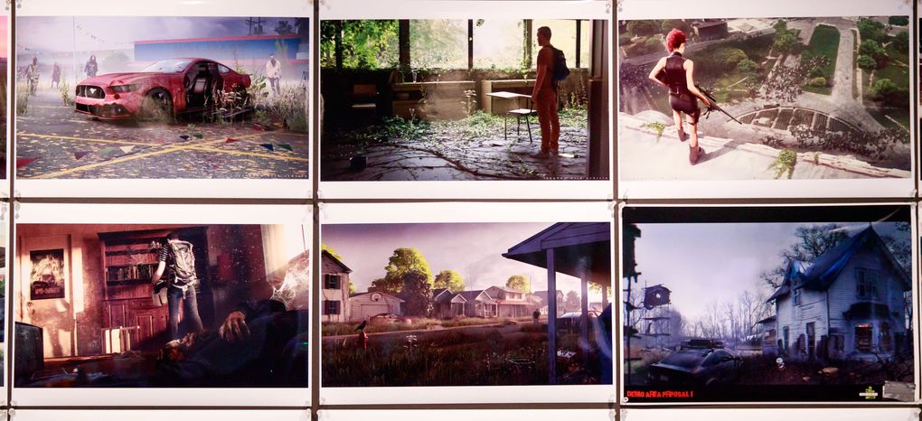 Concept art from the “State of Decay” franchise is displayed at Undead Labs in Pioneer Square. The post-apocalyptic survival game takes a novel approach, focusing less on fighting zombies and more on building a sustainable community for packs of survivors. (Erika Schultz/The Seattle Times)