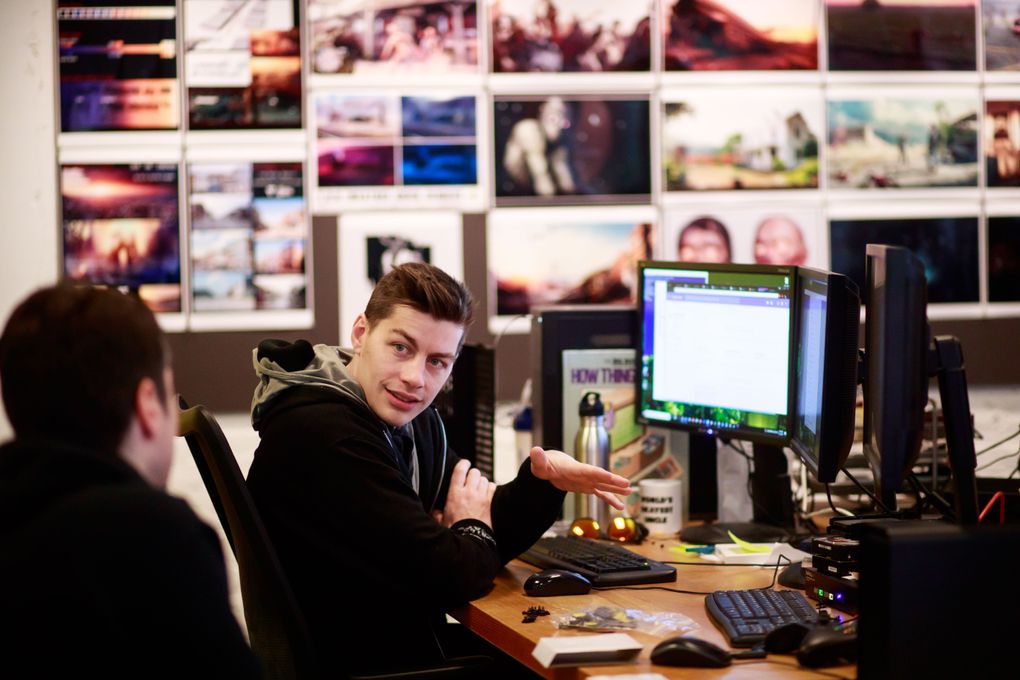 Noel Thompson, IT engineer, talks with Jared Chavez, programmer at Undead Labs earlier this month. (Erika Schultz/The Seattle Times)