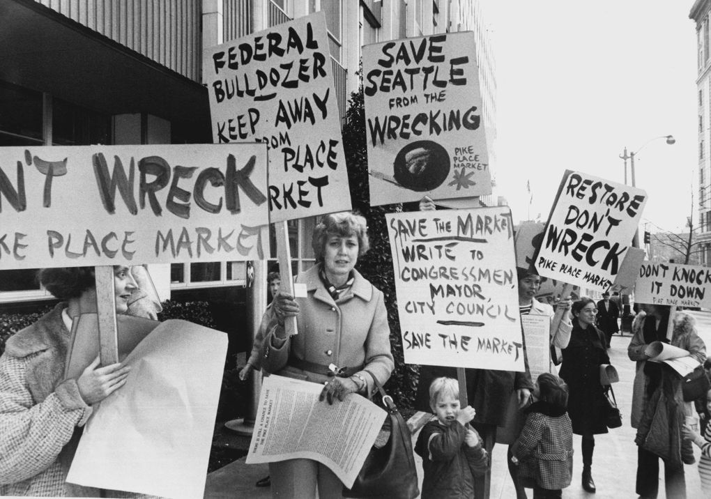 Sign-carrying members of The Friends of the Market and some of their children picketed City Hall to protest the proposed Pike Plaza plans. The Friends of the Market group held weekly demonstrations to protest the Pike Plaza urban-renewal program. (Richard S. Heyza/The Seattle Times, 1971)