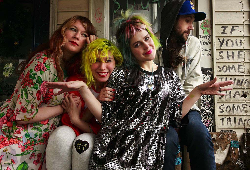 Since leaving her full-time job at The Stranger, Emily Nokes of Tacocat, second from right, has tightened her belt. When surprise expenses hit, like a car accident or medical issue, Nokes says she has to “triple hustle” with freelance jobs “and hope that it all works out. But it always does. At least so far.” (Erika Schultz/The Seattle Times, 2016)