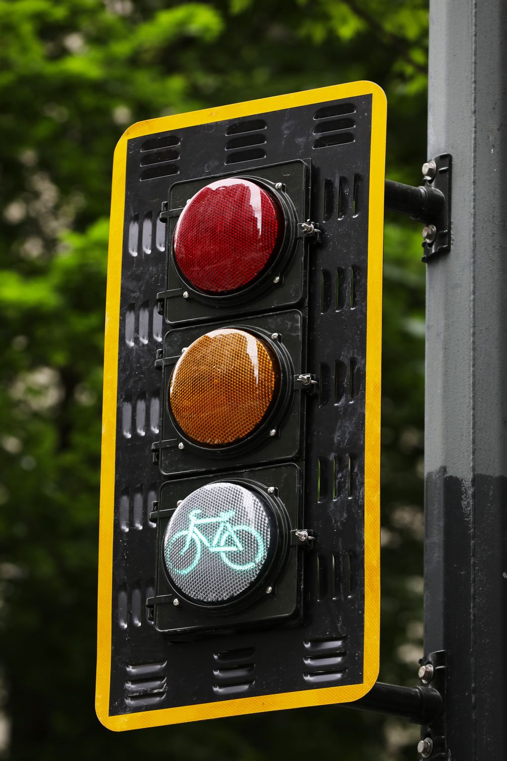 New signals like this one on Seventh Avenue tell cyclists when they can proceed. (Ken Lambert/The Seattle Times)