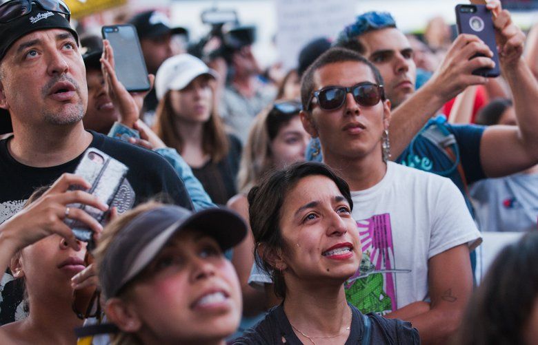 A woman cries during a march to protest immigration enforcement policies that separate children from their parents, in Los Angeles, June 14, 2018. Demonstrators in Los Angeles and dozens of other cities across the country protested the Trump administration?s zero-tolerance crackdown on illegal immigration on Thursday. (Andrew Cullen/The New York Times) XNYT5 XNYT5