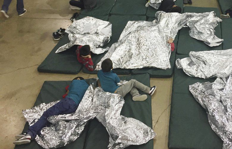 In this photo provided by U.S. Customs and Border Protection, people who’ve been taken into custody related to cases of illegal entry into the United States, rest in one of the cages at a facility in McAllen, Texas, Sunday, June 17, 2018. (U.S. Customs and Border Protection’s Rio Grande Valley Sector via AP) NYHK702 NYHK702