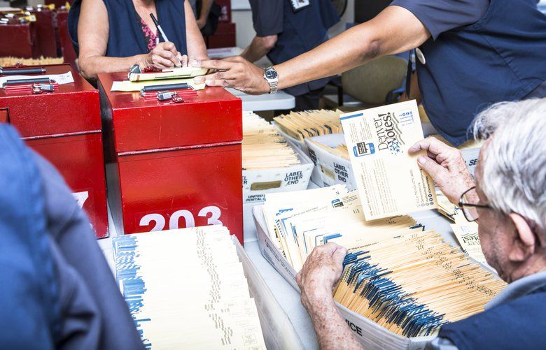 Election officials sort ballots in Denver on Tuesday, June 26, 2018. There are important primaries or runoff elections on Tuesday in seven states. (Ryan David Brown/The New York Times) XNYT139 XNYT139