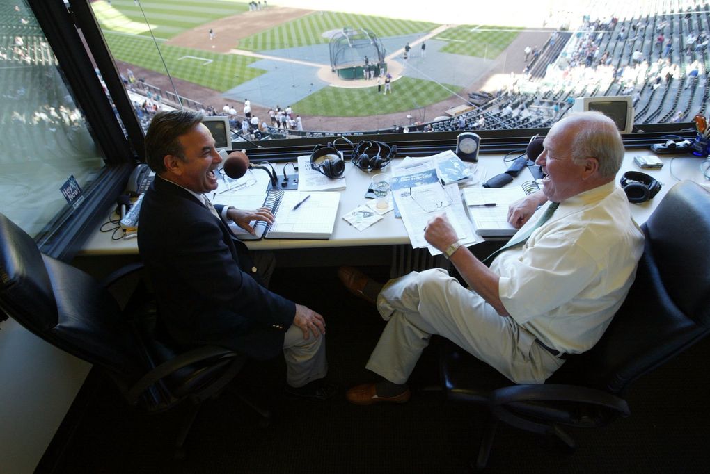 Mariner broadcasters Rick Rizzs, left, and Dave Niehaus share a laugh before a game at Safeco Field in 2004. (Rod Mar / The Seattle Times)
