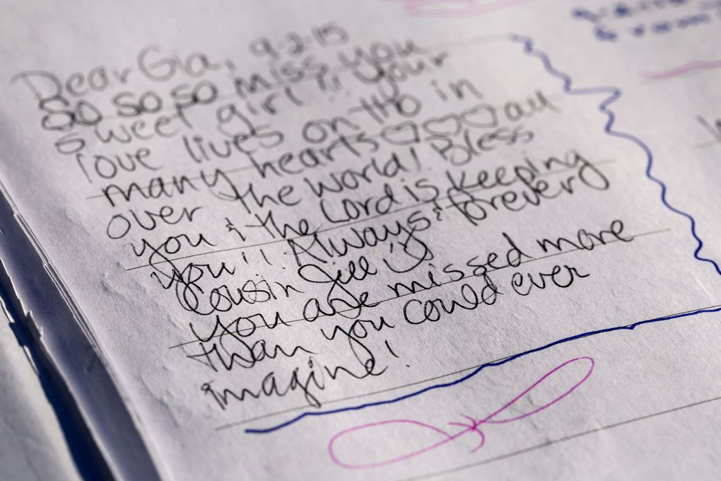 “You are missed more than you could ever imagine!” reads a message from a family member in a guestbook for Gia Soriano, on a memorial bench installed for her. (Bettina Hansen / The Seattle Times file, 2015)