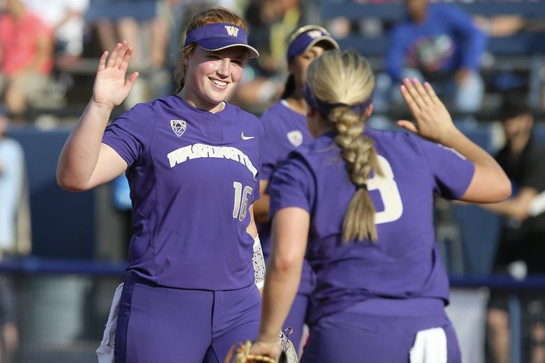 SEATTLE, WA - APRIL 17: Oregon Ducks catcher Terra McGowan (11) throws the  ball to first during a college softball game between the Oregon Ducks and  the Washington Huskies on April 17