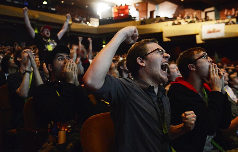 DOTA 2 COMPETITION 08/08/2013131962Sean McDonald, who traveled from Indiana to attend, pumps his fist as teams LGD of China and Alliance of Sweden go head-to-head in The International Dota 2 Championship for a share of almost $3 million in prizes at Benaroya Hall on Thursday, August 8, 2013. The event continues until Sunday as around 2,000 fans and 500,000+ online viewers watch the top 16 teams from around the world compete for the first place prize of $1.4 million.