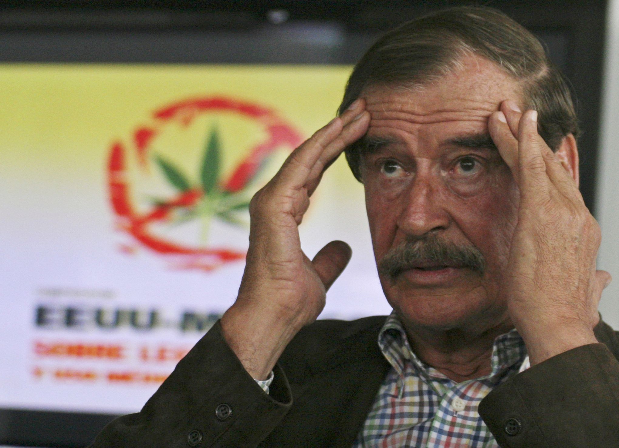 Former Mexican President Vicente Fox waits for an autograph prior