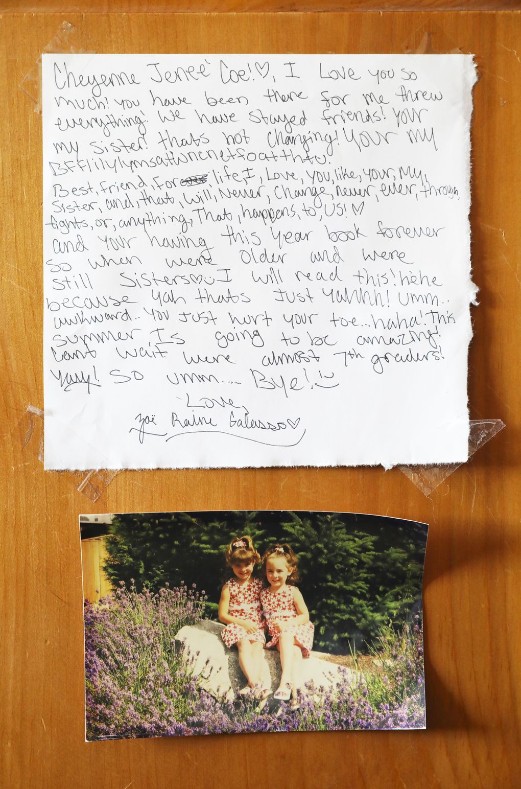 With the playful words of a middle-schooler, Zoe Galasso wrote a note to her “BFF” Cheyenne Coe in her sixth-grade yearbook, and now Coe hangs it on her wall. “Your having this year book forever so when we’re older and still sisters I will read this!” Below is a photo of Coe, left, and Galasso, right, around age 4 or 5. (Ken Lambert/The Seattle Times)