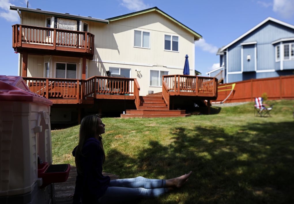 Cheyenne Coe can still picture her friend Zoe Galasso, who lived next door, calling out from her bedroom window. (Ken Lambert/The Seattle Times)