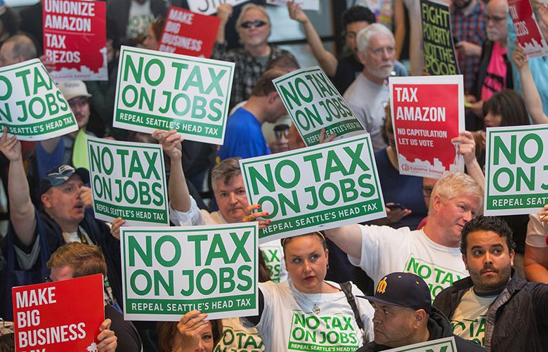 Supporters and opponents of Seattle‚Äôs controversial new head tax gather Tuesday at City Hall before the City Council plans to vote in a special meeting to repeal the tax.
Photographed on June 12, 2018. 206637