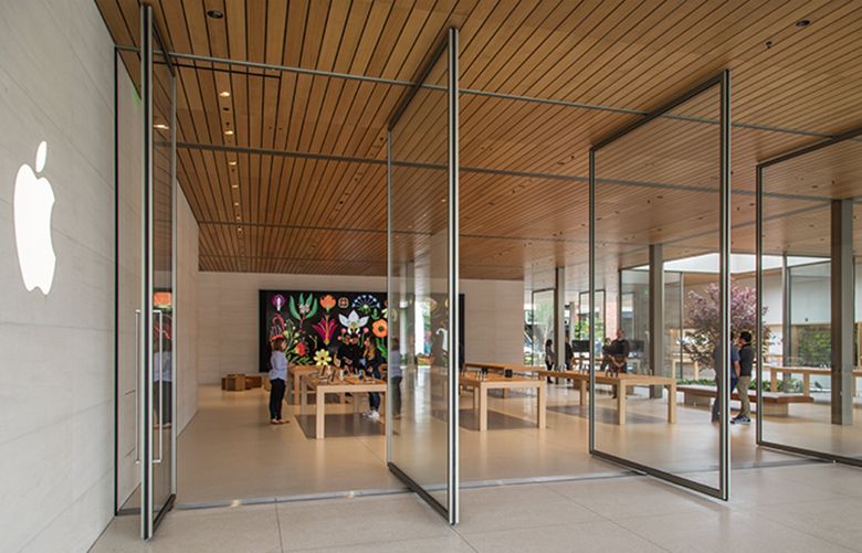 Thursday, June 28, 2018.   Entry into the new Apple retail store at University Village featuring large swinging doors from the outdoor lounging area.