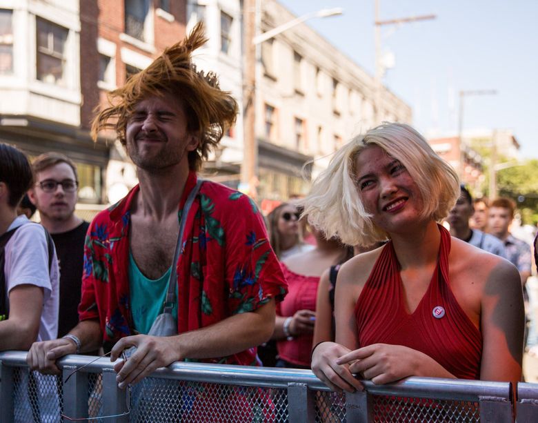 Sean Dodd (left) and Jennifer Ward head bang to the band Dude York at the Capitol Hill Block Party, on Friday, July 20, 2018. The Block Party continues with live music, food, and drinks on Saturday and Saturday. 207113 (Rebekah Welch / The Seattle Times)