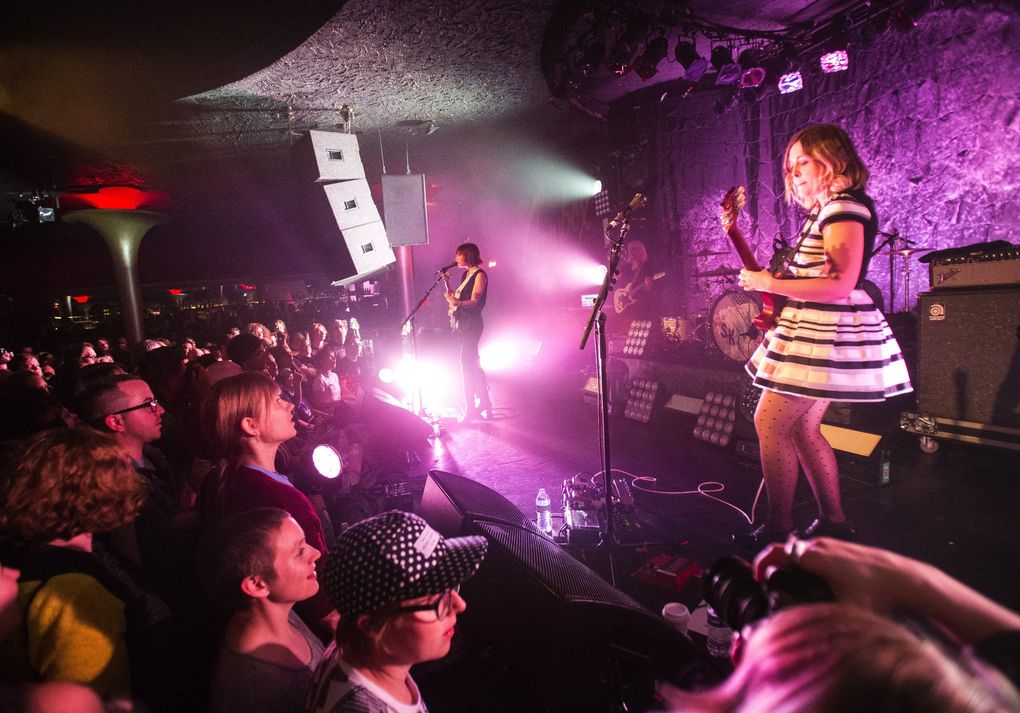 Guitarists and vocalists Carrie Brownstein, left, and Corin Tucker, right, perform as Sleater-Kinney on May 7, 2015, at The Showbox in Seattle. (Lindsey Wasson / The Seattle Times)