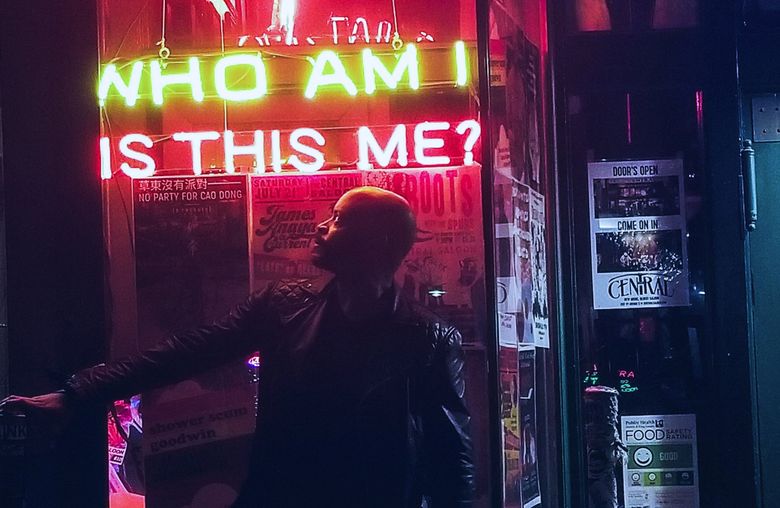 The neon signs at the Central Saloon in Pioneer Square beg fitting questions for Tyrone Beason, a longtimer having trouble relating to — and seeing himself reflected in — a city that is transforming seemingly beyond recognition. (Tyrone Beason / The Seattle Times)