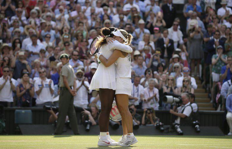 Germany’s Angelique Kerber hugs Serena Williams of the United States, left, after defeating her in the women’s singles final match, at the Wimbledon Tennis Championships, in London, Saturday July 14, 2018.(AP Photo/Tim Ireland) XVG265 XVG265