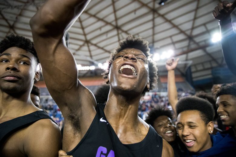 Jamon Kemp (1) of Garfield celebrates after beating Rainier Beach during the Hardwood Classic 3A championship game. (Courtney Pedroza / The Seattle Times)