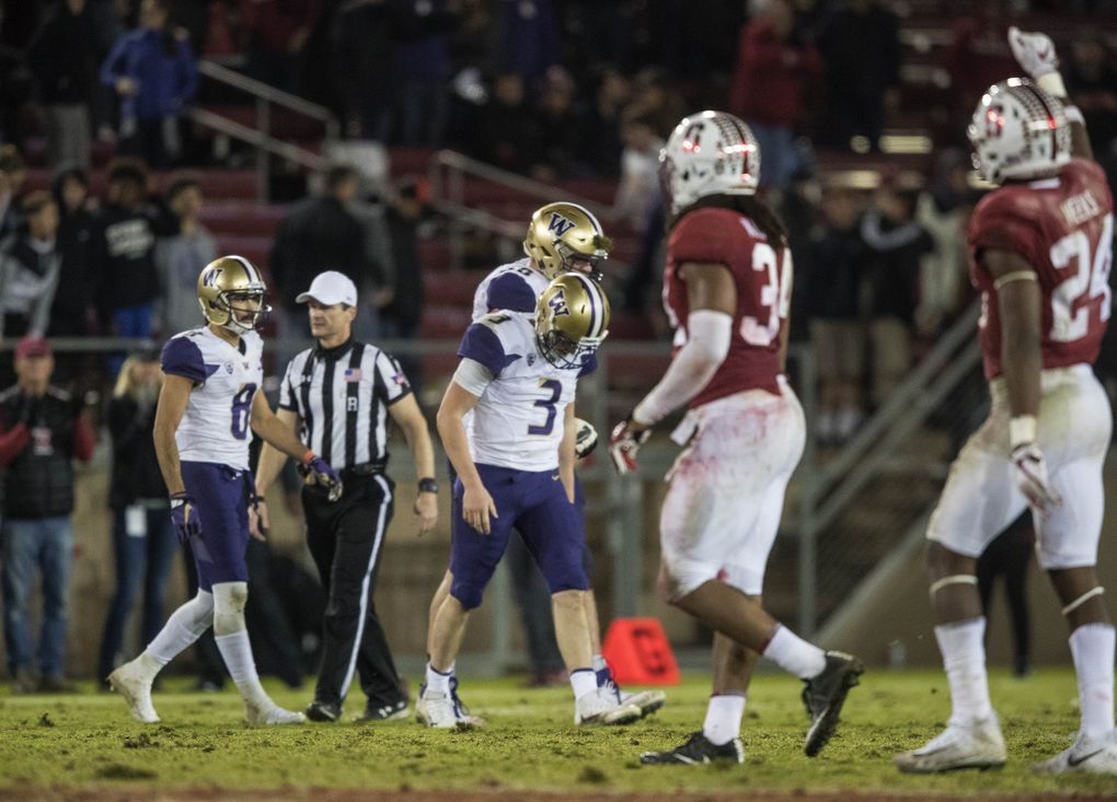 Jake Browning hangs his head after he was sacked on the final Washington possession of their loss at Stanford last season. (Dean Rutz / The Seattle Times)