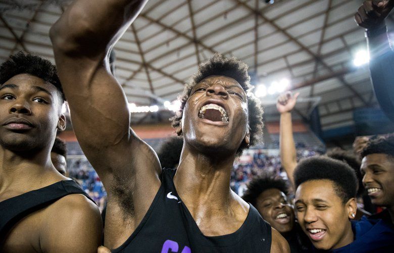 Jamon Kemp (1) of Garfield celebrates after beating Rainier during the Hardwood Classic 3A championship game at the Tacoma Dome, on Saturday, March 3, 2018, in Tacoma.
205392