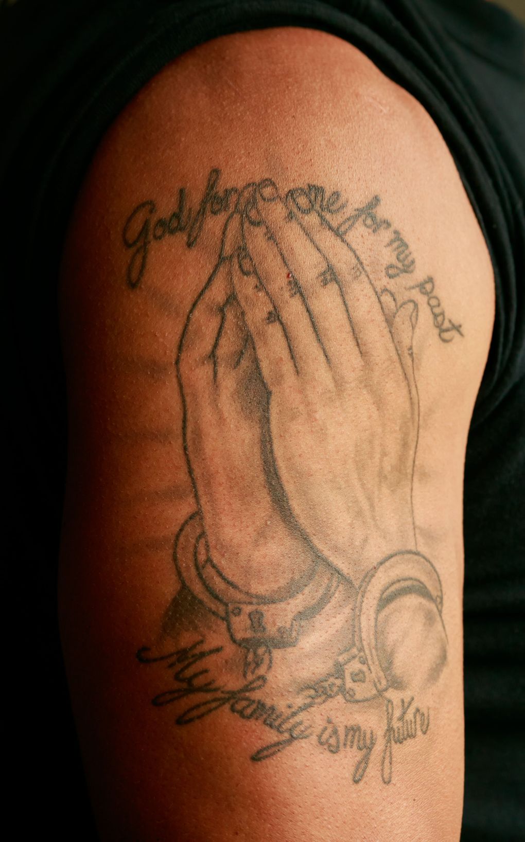 Juan Lopez’s tattoo honors his family. (Erika Schultz/The Seattle Times)