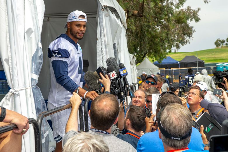 Dallas Cowboys quarterback Dak Prescott (4) wearing a t-shirt with