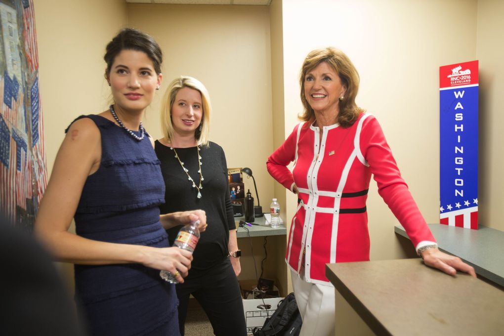 Susan Hutchison calls together her campaign staff before heading downstairs to meet reporters. (Dean Rutz / The Seattle Times)