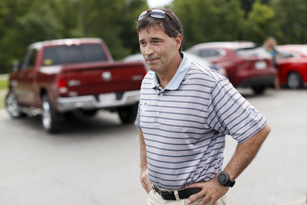 Republican Troy Balderson, a candidate for Ohio’s 12th District, stands in the parking lot of a voting precinct at Genoa Baptist Church in Westerville, Ohio. Balderson, is fighting off a strong challenge from Democrat Danny O’Connor, 31-year-old county official, in a congressional district held by the Republican Party for more than three decades. (John Minchillo / The Associated Press)